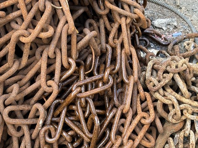 Pile of used open link chain in our depot